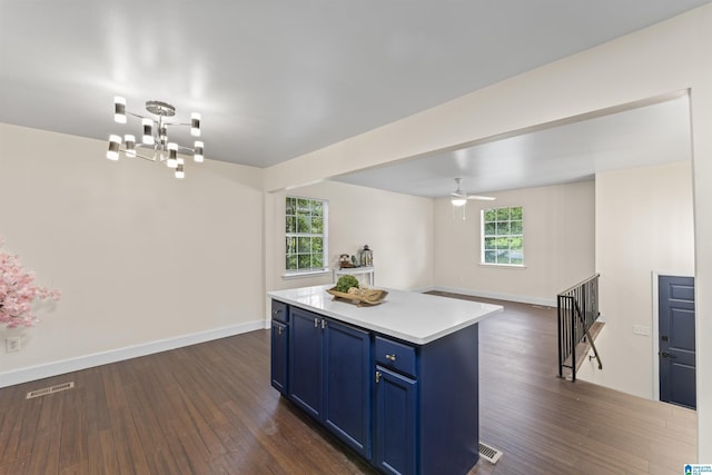 2649 6th St NE, Center Point, AL 35215 - kitchen featuring blue cabinets, dark wood finished floors, a chandelier, light countertops, and open floor plan