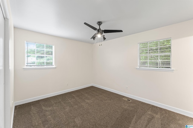 2649 6th St NE, Center Point, AL 35215 - empty room with a ceiling fan and dark colored carpet