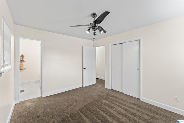 2649 6th St NE, Center Point, AL 35215 - unfurnished bedroom with carpet, a closet, ensuite bathroom, and a ceiling fan