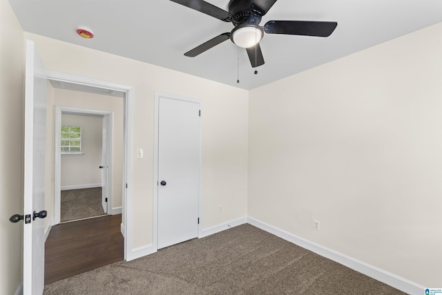 2649 6th St NE, Center Point, AL 35215 - unfurnished bedroom featuring dark carpet and a ceiling fan