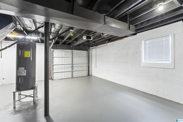 2649 6th St NE, Center Point, AL 35215 - garage with electric water heater, a garage door opener, and concrete block wall