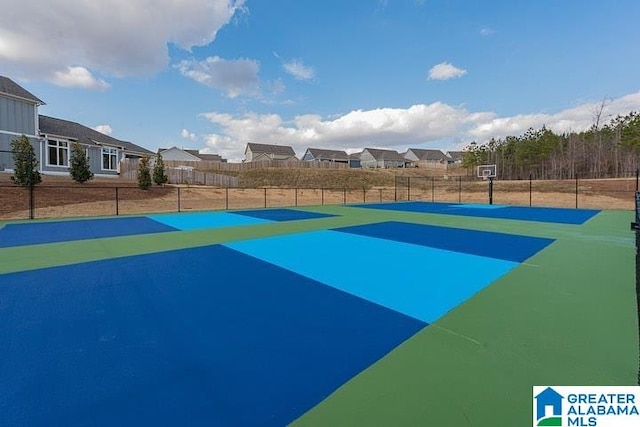 5181 Cruise St, Trussville, AL 35173 - view of sport court featuring basketball hoop and a residential view