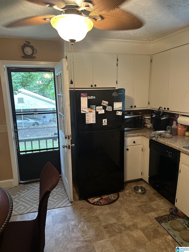 1988 County Rd, Alexander City, AL 35010 - kitchen with black appliances and white cabinets