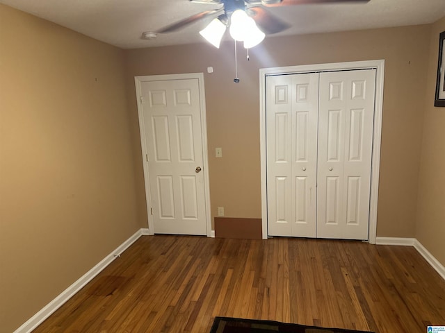 1988 County Rd, Alexander City, AL 35010 - unfurnished bedroom featuring dark wood-style flooring, a closet, and a ceiling fan