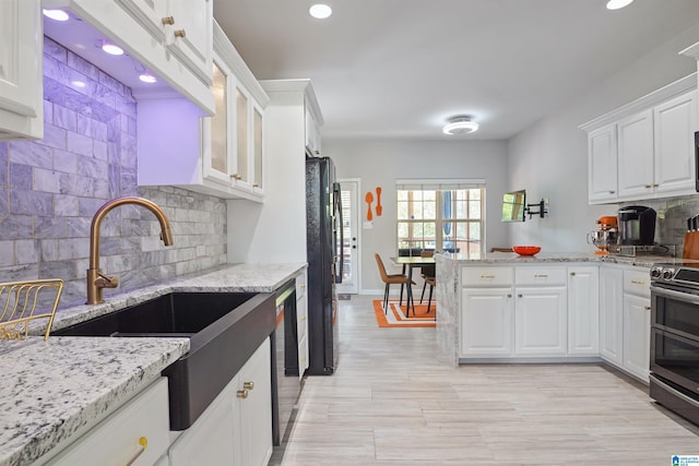 2816 Aster Lake Rd, Helena, AL 35022 - kitchen featuring stainless steel appliances, white cabinets, tasteful backsplash, recessed lighting, and light stone countertops