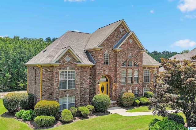 2816 Aster Lake Rd, Helena, AL 35022 - view of front of home with brick siding, a front lawn, and roof with shingles