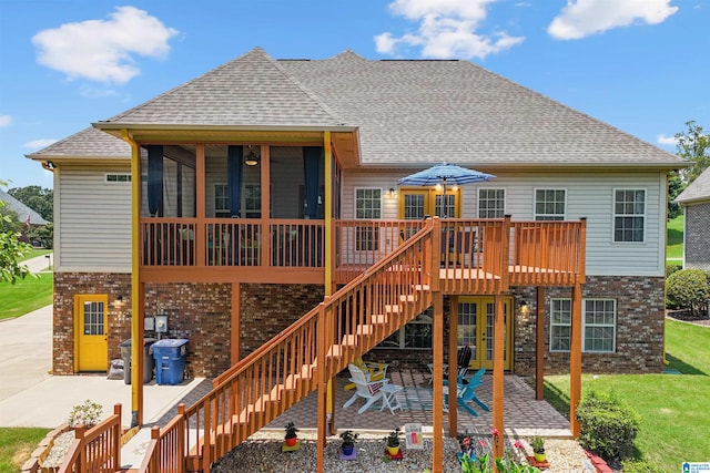 2816 Aster Lake Rd, Helena, AL 35022 - back of house featuring a patio area, brick siding, a sunroom, a shingled roof, and stairs
