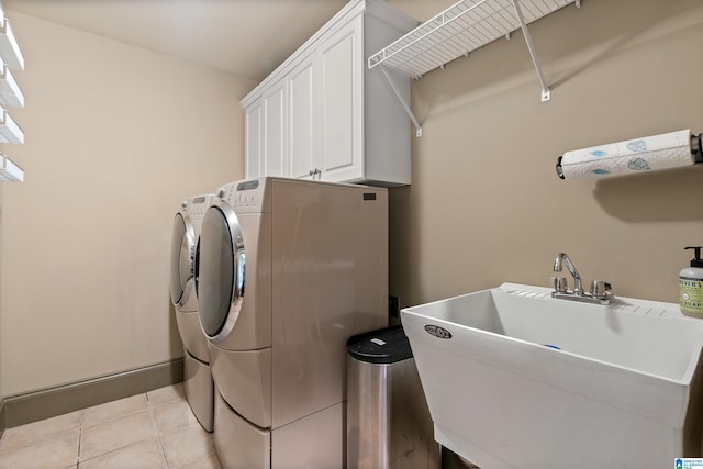 163 River Valley Rd, Helena, AL 35080 - laundry room with washing machine and clothes dryer, cabinet space, and light tile patterned floors