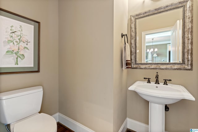 163 River Valley Rd, Helena, AL 35080 - bathroom with toilet and a chandelier
