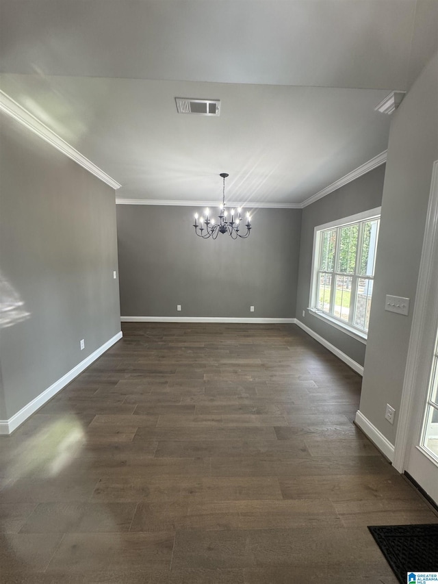 21320 Callie Cir, Mccalla, AL 35111 - unfurnished dining area with ornamental molding, a chandelier, and dark wood-type flooring