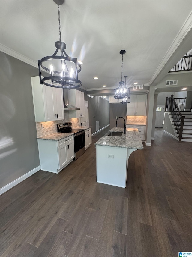 21320 Callie Cir, Mccalla, AL 35111 - kitchen with stainless steel electric range, a chandelier, crown molding, dark wood-style floors, and backsplash