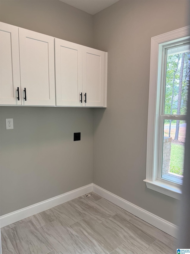 21320 Callie Cir, Mccalla, AL 35111 - laundry area with cabinet space and hookup for an electric dryer