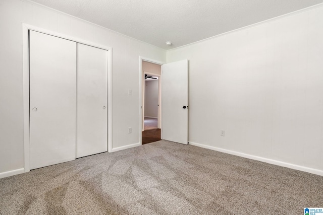 4533 Oak Dr, Pinson, AL 35126 - unfurnished bedroom featuring carpet flooring, ornamental molding, and a closet