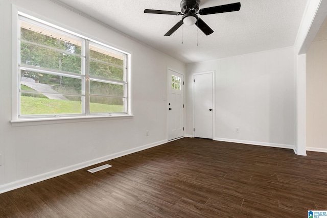 4533 Oak Dr, Pinson, AL 35126 - spare room featuring dark wood-type flooring, ceiling fan, and a textured ceiling