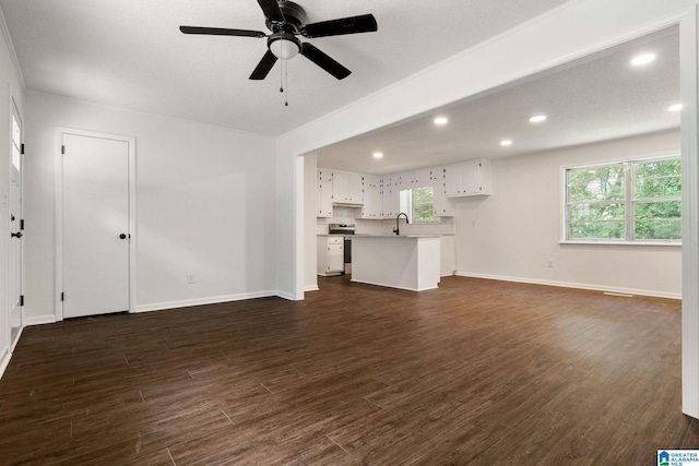 4533 Oak Dr, Pinson, AL 35126 - unfurnished living room with dark wood finished floors, a ceiling fan, and recessed lighting