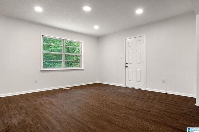 4533 Oak Dr, Pinson, AL 35126 - unfurnished room with dark wood-style floors, recessed lighting, and a textured ceiling