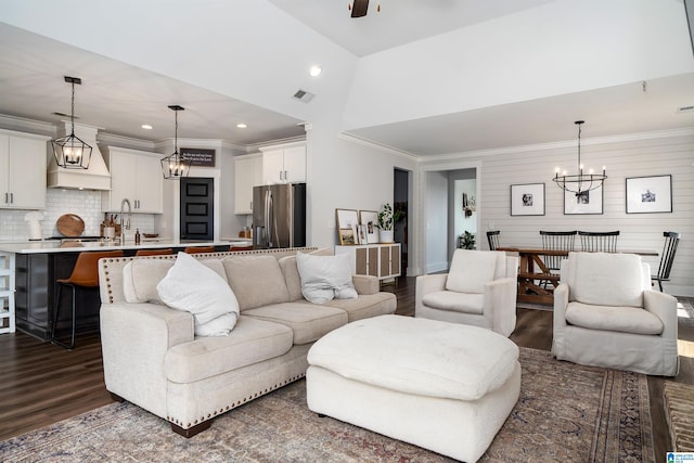 4945 Natalie Way, Trussville, AL 35173 - living area with dark wood-style flooring, a chandelier, a ceiling fan, ornamental molding, and recessed lighting