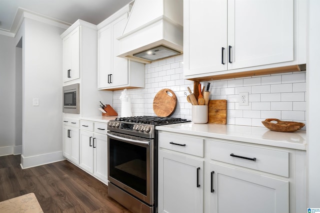 4945 Natalie Way, Trussville, AL 35173 - kitchen featuring stainless steel appliances, premium range hood, ornamental molding, light countertops, and dark wood-style floors