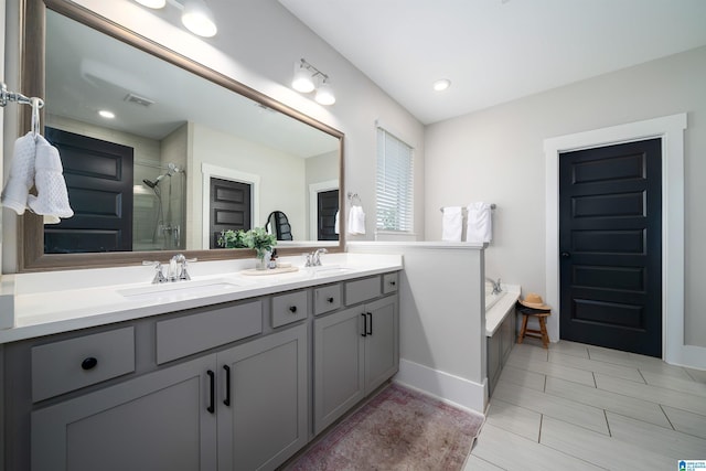 4945 Natalie Way, Trussville, AL 35173 - bathroom featuring double vanity, a stall shower, and a garden tub