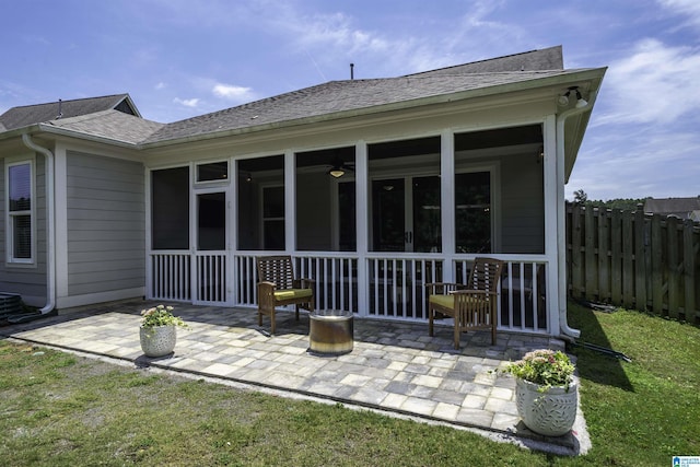 4945 Natalie Way, Trussville, AL 35173 - back of property with a sunroom, a shingled roof, and a patio