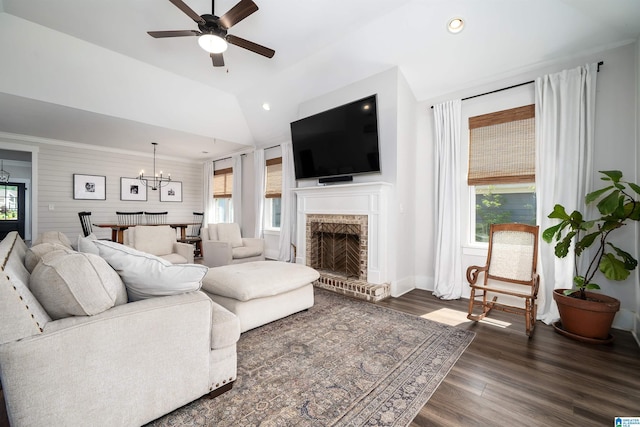 4945 Natalie Way, Trussville, AL 35173 - living room with a chandelier, a ceiling fan, a fireplace, wood finished floors, and vaulted ceiling