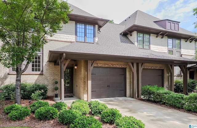 1186 Inverness Cove Way, Hoover, AL 35242 - view of front facade featuring roof with shingles, concrete driveway, and brick siding