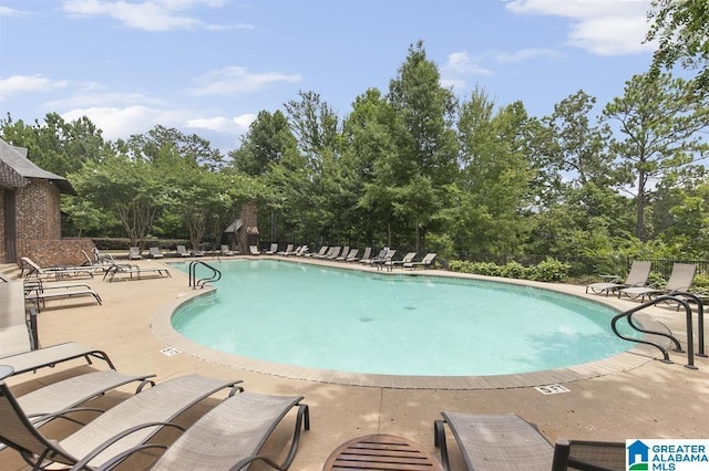 1186 Inverness Cove Way, Hoover, AL 35242 - community pool featuring a patio and view of scattered trees