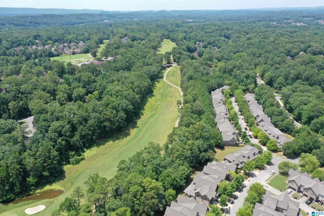 1186 Inverness Cove Way, Hoover, AL 35242 - aerial perspective of suburban area with a heavily wooded area and a golf course