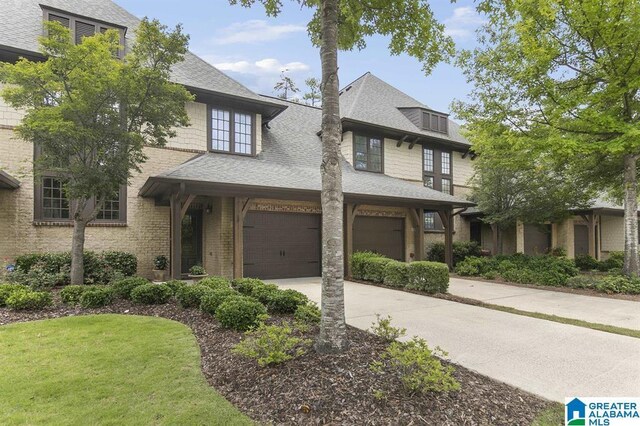 1186 Inverness Cove Way, Hoover, AL 35242 - view of front of property featuring concrete driveway, a shingled roof, and a garage