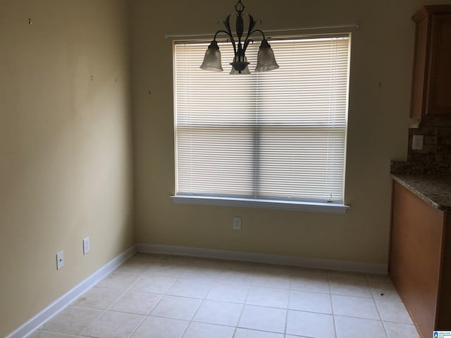155 Highview Cv, Pelham, AL 35124 - unfurnished dining area with a chandelier, light tile patterned floors, and plenty of natural light