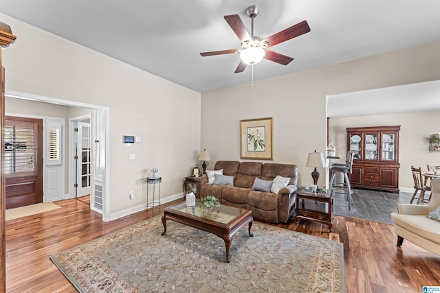 417 Rock View Trl, Maylene, AL 35114 - living area featuring wood finished floors and ceiling fan