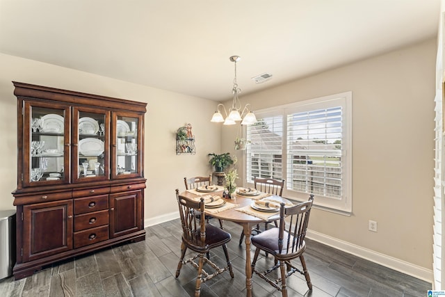 417 Rock View Trl, Maylene, AL 35114 - dining area featuring dark wood-style flooring and a chandelier
