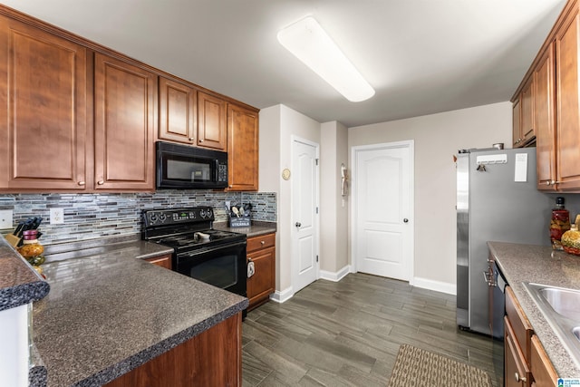 417 Rock View Trl, Maylene, AL 35114 - kitchen featuring black appliances, decorative backsplash, dark countertops, and brown cabinets
