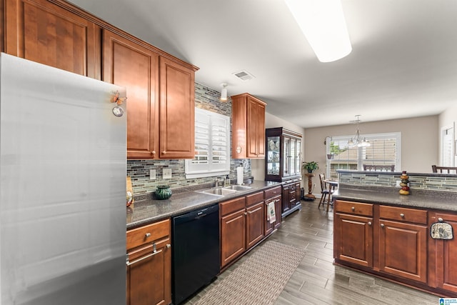 417 Rock View Trl, Maylene, AL 35114 - kitchen with dishwasher, freestanding refrigerator, dark countertops, and backsplash