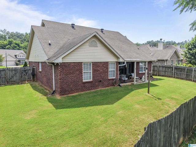 417 Rock View Trl, Maylene, AL 35114 - rear view of property with brick siding, a fenced backyard, a patio area, and a shingled roof