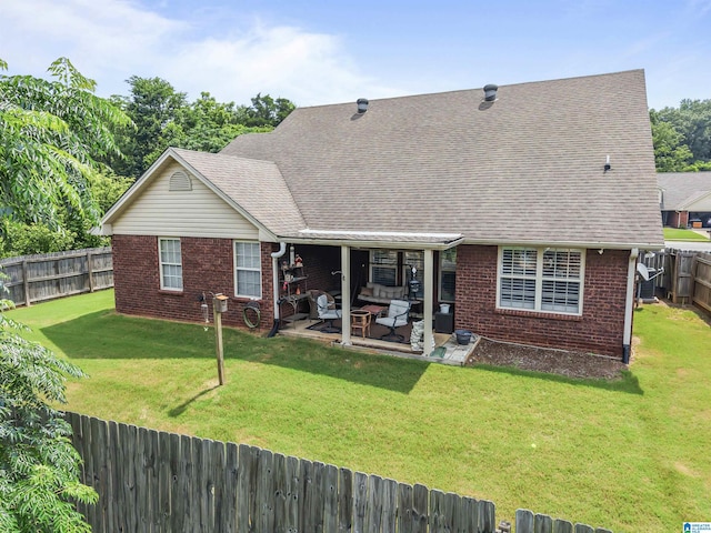 417 Rock View Trl, Maylene, AL 35114 - back of property featuring brick siding, an outdoor hangout area, a fenced backyard, a patio, and roof with shingles