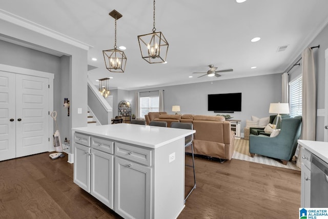 7808 Jayden Dr, Trussville, AL 35173 - kitchen with dishwasher, a chandelier, a ceiling fan, light countertops, and dark wood-type flooring