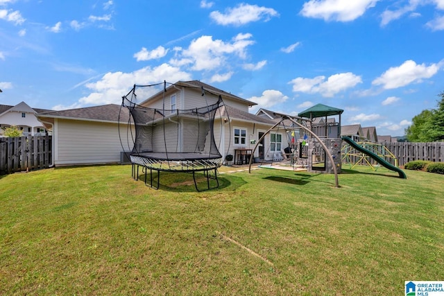 7808 Jayden Dr, Trussville, AL 35173 - rear view of property featuring a trampoline and a playground