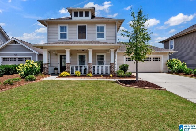 7808 Jayden Dr, Trussville, AL 35173 - view of front facade with covered porch, a garage, driveway, a front yard, and a shingled roof
