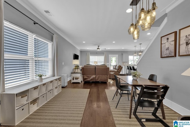 7808 Jayden Dr, Trussville, AL 35173 - dining area with a chandelier, a ceiling fan, ornamental molding, recessed lighting, and dark wood-style flooring