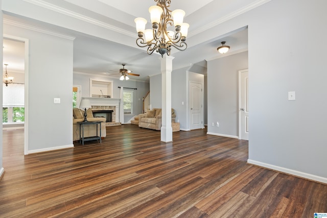 3168 Cahaba Park Dr, Trussville, AL 35173 - unfurnished living room with a chandelier, dark wood-style flooring, crown molding, a ceiling fan, and a fireplace