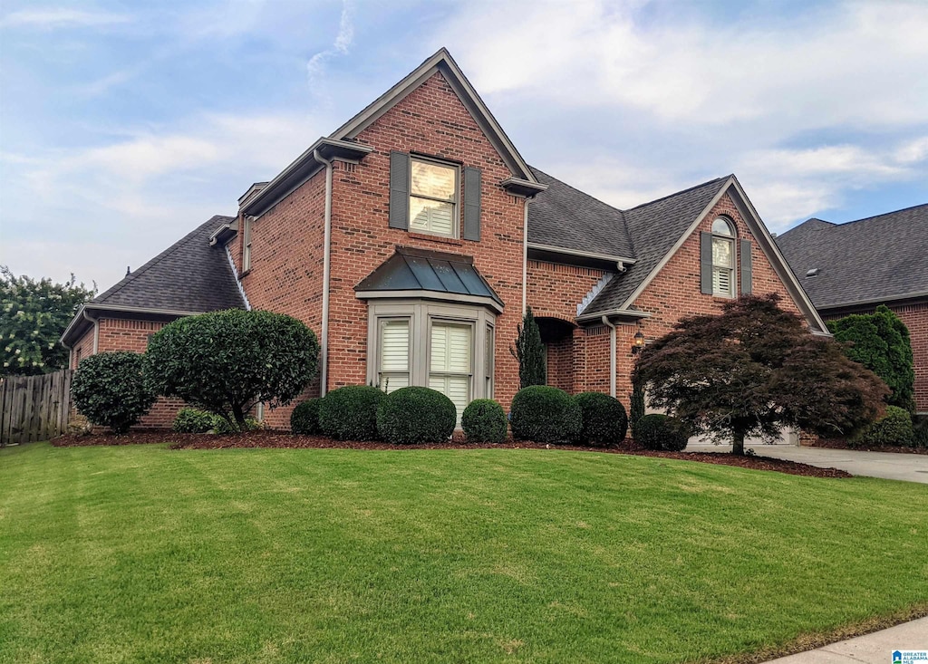 4081 Crossings Ln, Hoover, AL 35242 - traditional home featuring brick siding and roof with shingles
