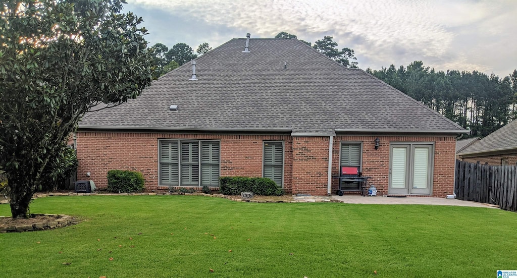 4081 Crossings Ln, Hoover, AL 35242 - rear view of property with a patio, brick siding, and a shingled roof