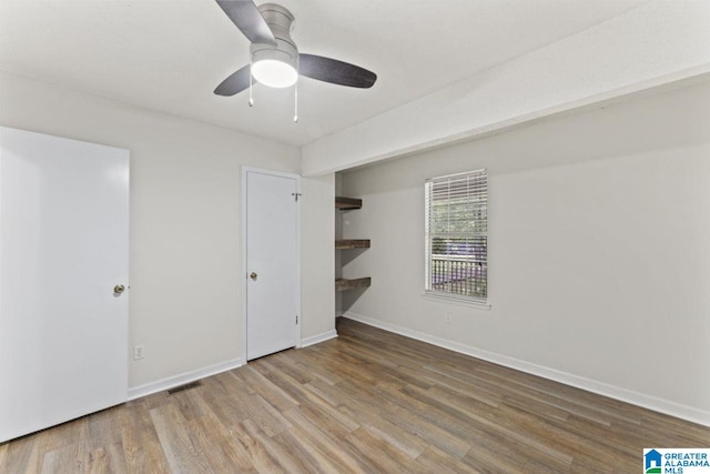 6256 Alabama Dr, Trussville, AL 35173 - unfurnished bedroom with wood finished floors and ceiling fan
