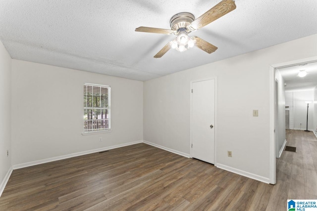 6256 Alabama Dr, Trussville, AL 35173 - unfurnished bedroom featuring wood finished floors, a textured ceiling, and a ceiling fan