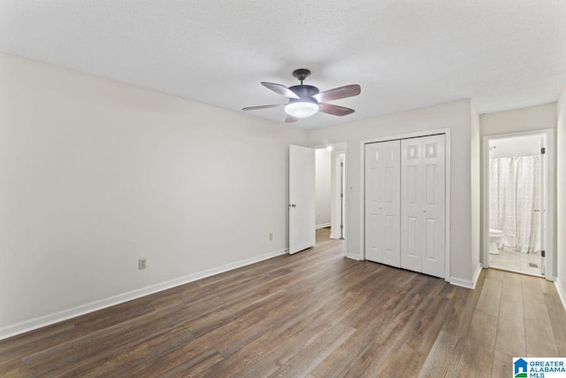 6256 Alabama Dr, Trussville, AL 35173 - unfurnished bedroom featuring wood finished floors, a closet, and a ceiling fan