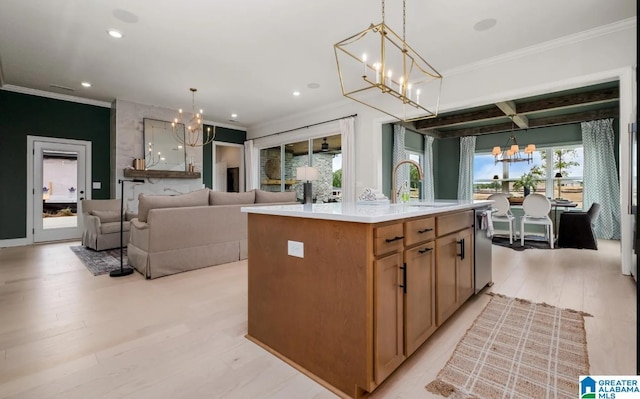 500 Simms Lndg, Pelham, AL 35124 - kitchen with a chandelier, crown molding, a center island with sink, light wood-style floors, and recessed lighting