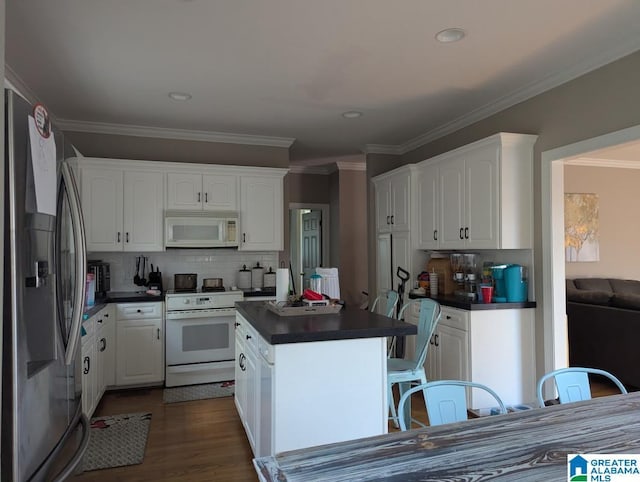 100 Emily Cir, Birmingham, AL 35242 - kitchen with white appliances, dark countertops, white cabinetry, decorative backsplash, and ornamental molding