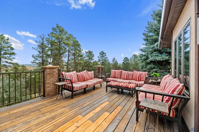 wooden deck with outdoor lounge area