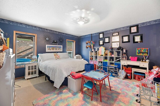 carpeted bedroom featuring a textured ceiling